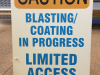caution blasting coating sandwich board sign