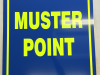fluorescent muster point signs