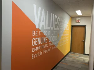 This image shows motivational wall graphics mural for office hallway.