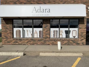 This image shows hair salon window perforation vinyl graphics.