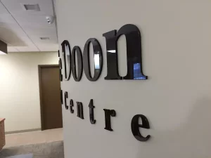 This image shows laser cut acrylic reception signage.