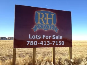 This image shows lots for sale sign.