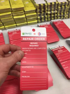 This image shows plastic outdoor safety tags with hole.