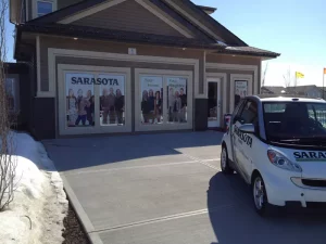This image shows show home window see through decals and vehicle wrap.