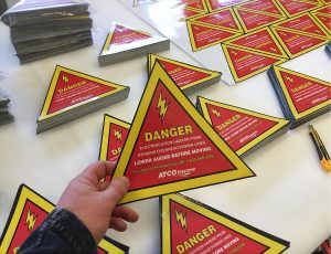 This image shows danger acto sticker edmonton.