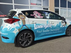 Vehicle Wrap For Swim School This image shows vehicle wrap for swim school.