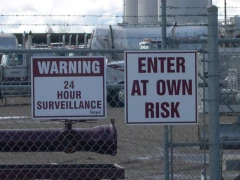 Warning Signs On Fence This image shows warning signs on fence.